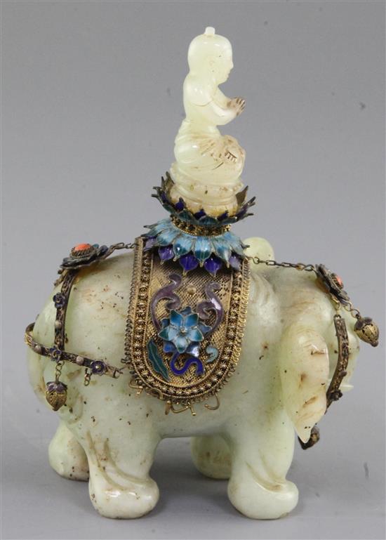 A Chinese celadon jade and filigree work group of Buddha riding an elephant, early 20th century, total height 14.5cm, length 9.8cm